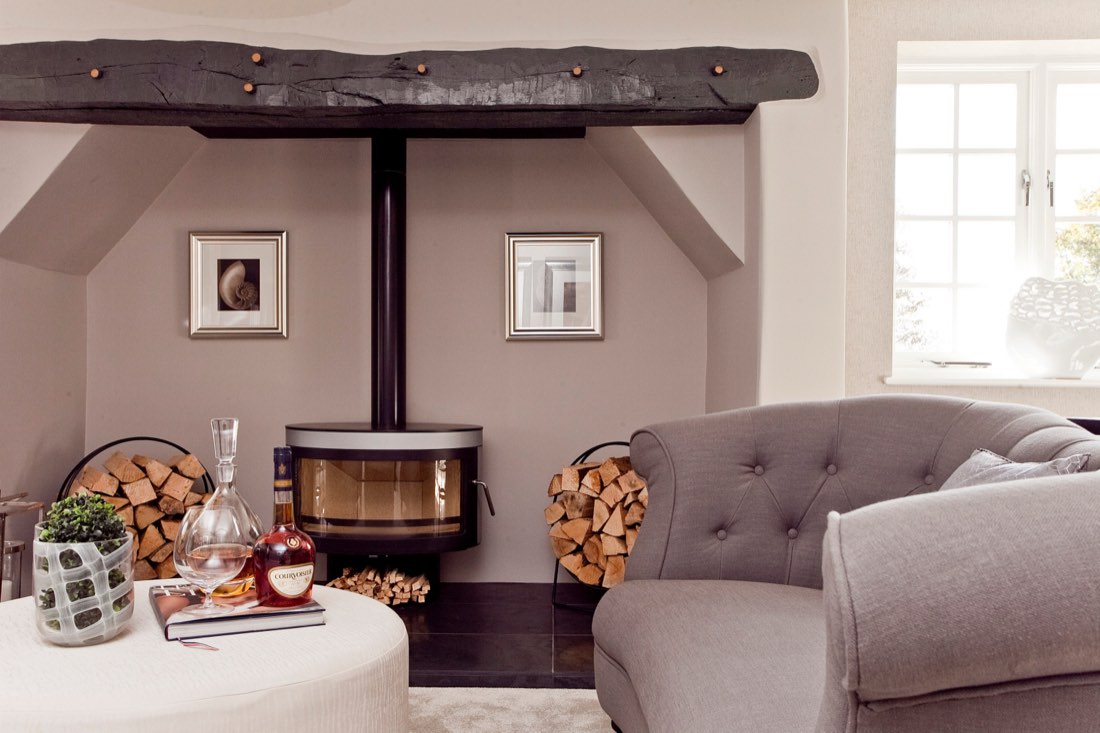A snug with a wood-burning stove in a completed self-build